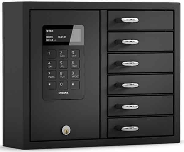 211290 Woman selects a key from a Key Box System