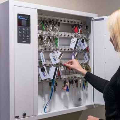 Automated Key Management Systems Woman selects a key from a Key Box System