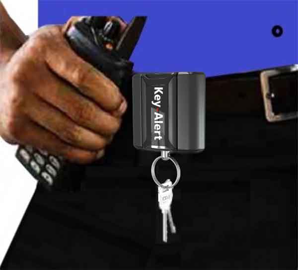 New-Key-Alert-Key-Locater-System-2025 Woman selects a key from a Key Box System