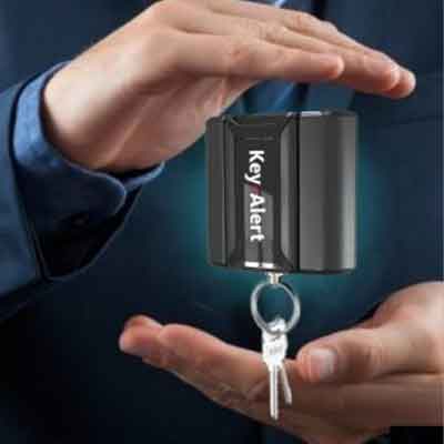 alert-pro-key-locator-tethering-systems Woman selects a key from a Key Box System